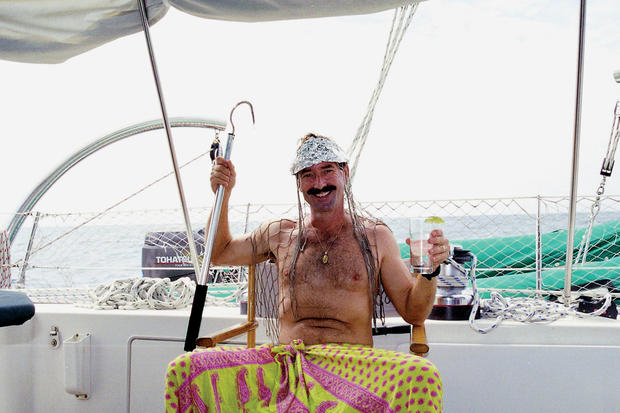 Captain John Silverwood, dressed as "King Neptune," celebrates crossing the equator into the Southern Hemisphere. 