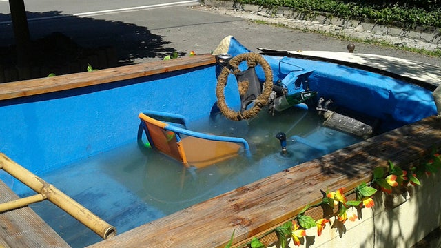 A car that has been converted into a drivable pool is seen in this picture provided by the police in Chemnitz, Germany, June 23, 2013. 