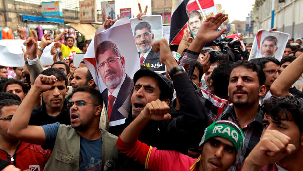 Supporters of Egypt's ousted president Mohamed Morsi shout slogans condemning the latest killings in Egypt during a demonstration in the Yemeni capital, Sanaa, on July 28, 2013. 