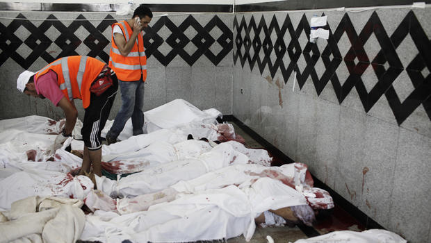 Bodies of supporters of deposed Egyptian President Mohammed Morsi lie on the floor of a field hospital, after reportedly being killed in fighting between pro-Morsi demonstrators and Egyptian security forces overnight, near the Rabaa al Adweya Mosque in the district of Nasr on July 27, 2013 in Cairo, Egypt. 