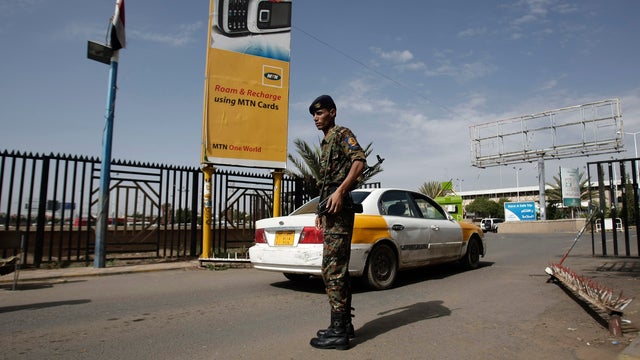 A policeman stands guard at the entrance of Sanaa International Airport 