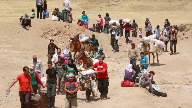 In this photo released by the Syrian official news agency SANA, a Syrian victim who suffered an alleged chemical attack at Khan al-Assal village according to SANA, receives treatment by doctors, at a hospital in Aleppo, Syria, Tuesday March 19, 2013. The  