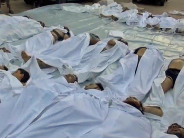 The bodies of people killed in an alleged "poisonous gas" attack are seen in a makeshift morgue in the eastern Ghouta suburbs of Damascus 