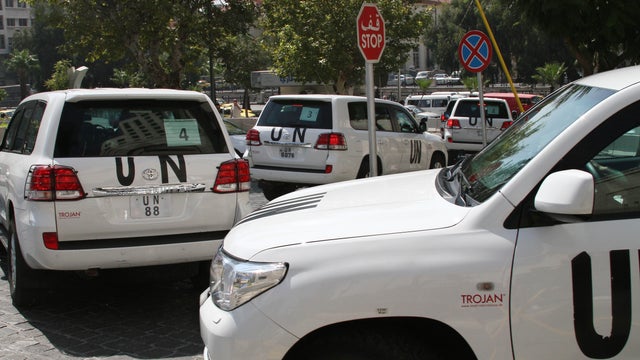 U.N. team scheduled to investigate an alleged chemical attack that killed hundreds last week in a Damascus suburb, leaves their Damascus hotel 