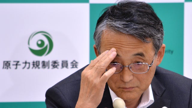 Shunichi Tanaka, chairman of the Japanese Nuclear Regulation Authority, listens to a questi 