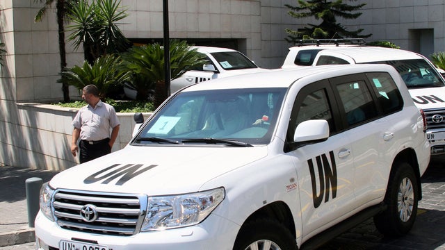 U.N. experts leave a hotel in Damascus, Syria, Aug. 30, 2013. 