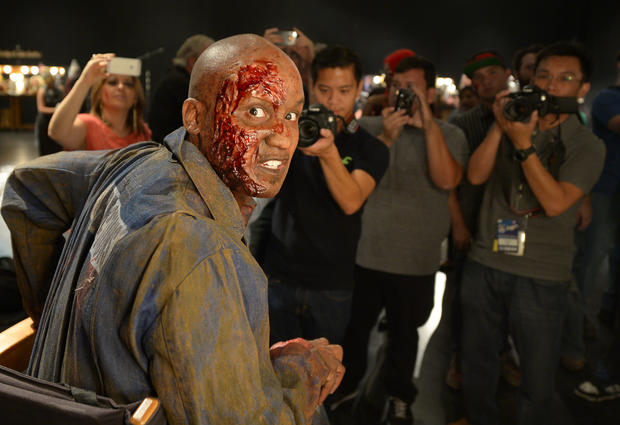 Journalists take photos of a made-up character from Walking Dead 