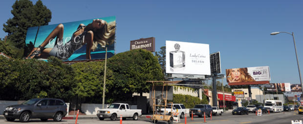 Giant advertising billboards are seen in 