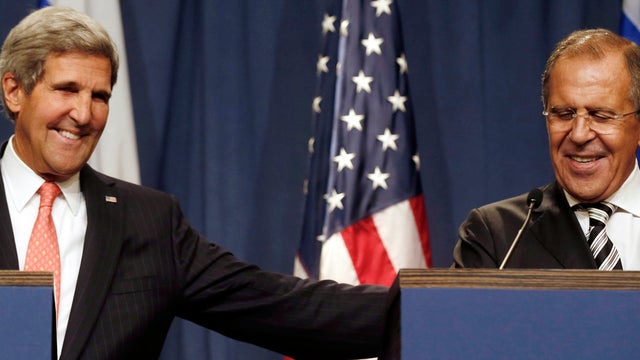 U.S. Secretary of State John Kerry, left, and Russian Foreign Minister Sergey Lavrov make statements to the media following meetings regarding Syria in Geneva Sept. 14, 2013. 