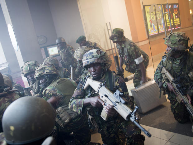 Armed police leave after entering the Westgate Mall in Nairobi, Kenya, Sept. 21, 2013. 
