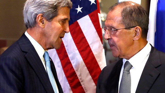 Secretary of State John Kerry, left, and Russian Foreign Minister Sergei Lavrov shake hands 