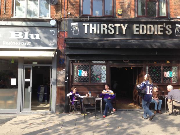 two-vikings-fans-enjoying-a-drink-outside-a-pub-before-the-game.jpg 