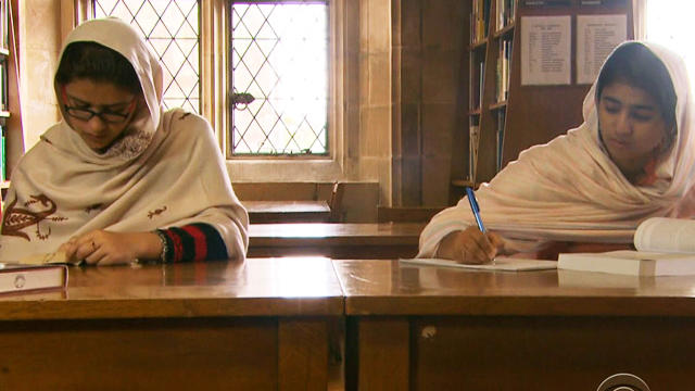 Kainat Riaz and Shazia Ramzan study in the library at Atlantic College. 