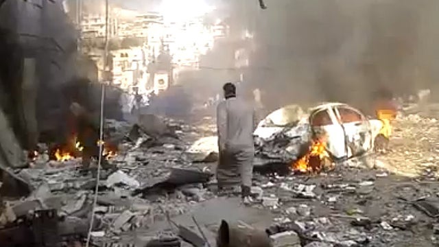 The damage done by a car bomb near a market in Darkoush, Idlib province 
