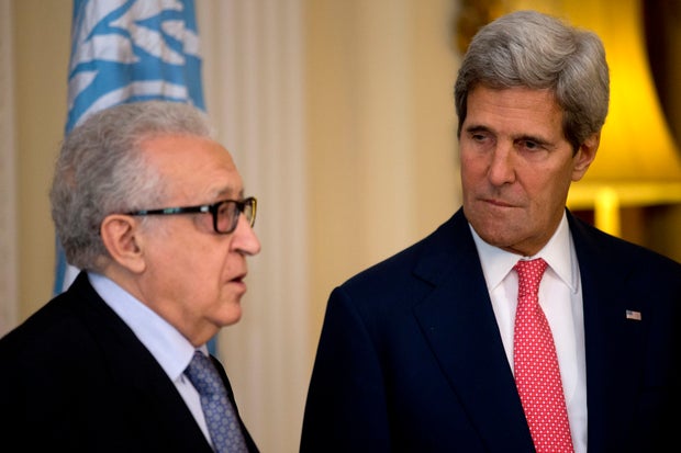 U.N-Arab League envoy for Syria Lakhdar Brahimi speaks next to U.S. Secretary of State John Kerry