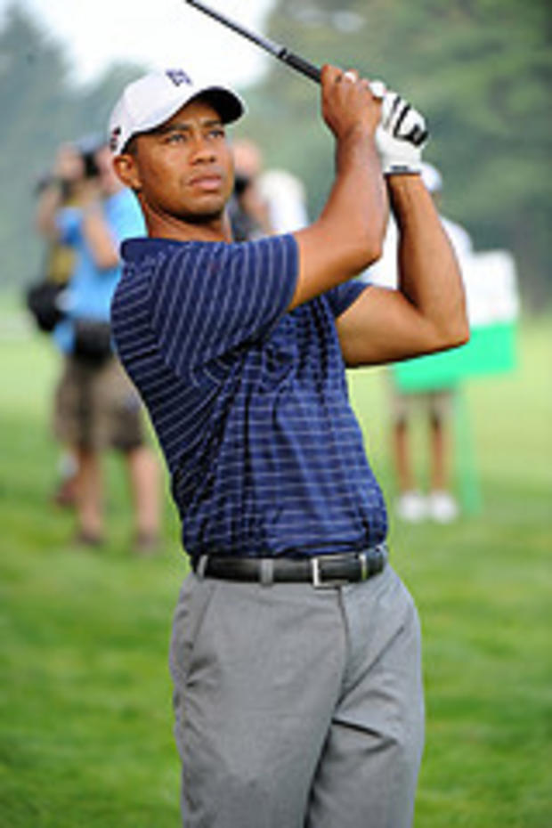 Tiger Woods tees off 