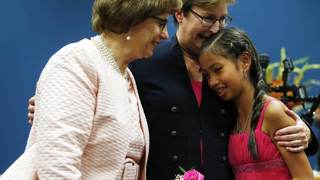 Beth Asaro, left, and Joanne Schailey share moment with their daughter Kate, 13, after they exchanged vows to become first same-sex wedded couple in Lambertville, N.J. history at 12:01 a.m. Oct. 21, 2013 in Lambertville 
