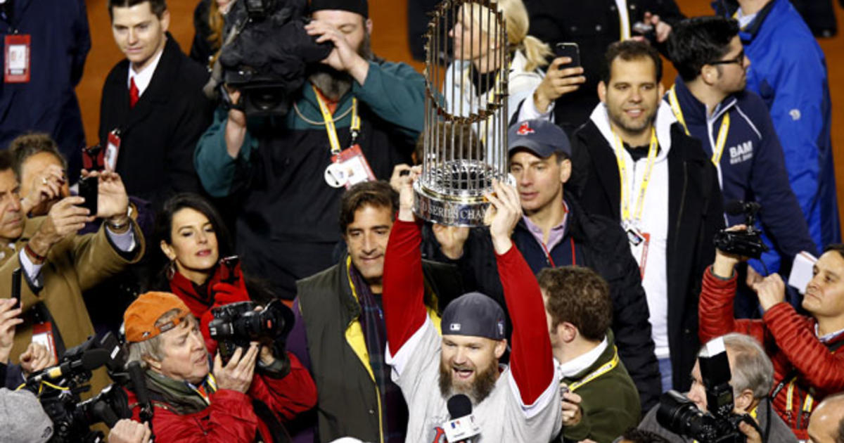 Boston Red Sox catcher David Ross (L-R) relief pitcher Koji Uehara and the  rest of the team celebrate after the final out of Game 6 of the World  Series against the St.