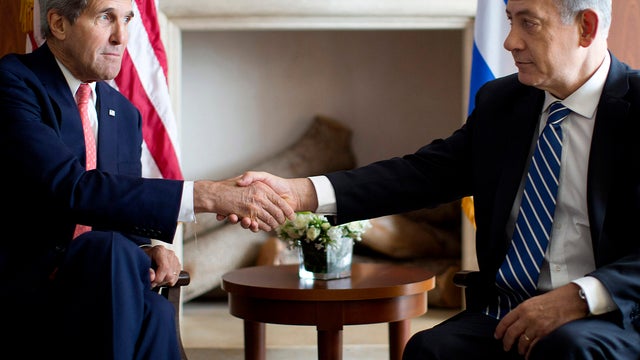 Secretary of State John Kerry, right, shakes hands with Israeli Prime Minister Benjamin Netanyahu  