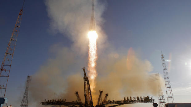 Soyuz carries Olympic torch to space 