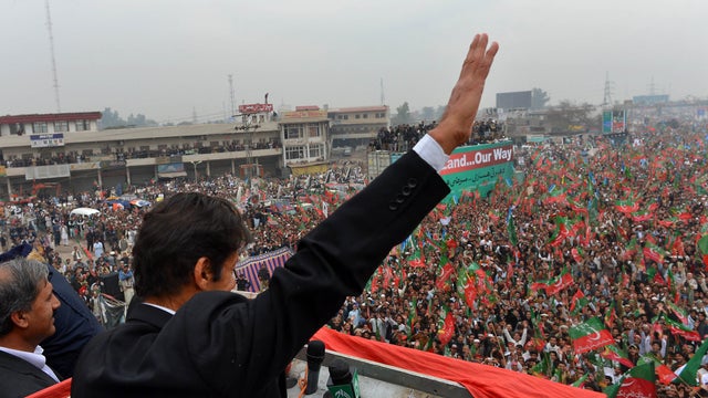 Imran Khan, Chairman of Pakistan Tehreek-e-Insaaf (PTI) party, gestures while addressing an anti-drone strike protest rally in Peshawar 