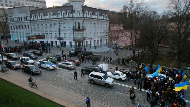 Protesters block a street leading to the building of Cabinet of Ministers in Kiev 