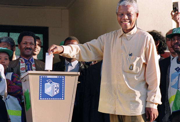 ANC President Nelson Mandela casts his historic vote during South Africa's first democratic and all-race general elections on  April 27, 1994. 