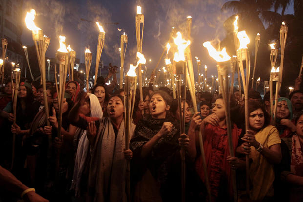 Bangladeshi activists shout slogans as they participate in a torch rally in Dhaka, Bangladesh. 