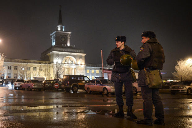 Interior Ministry members stand guard in front of the train station where a bomber detonated explosives in Volgograd 