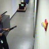 Aaron Alexis moves through the hallways of Building #197 at the Washington Navy Yard in Washington carrying a Remington 870 shotgun Sept. 16, 2013, in this handout framegrab provided by the FBI. 
