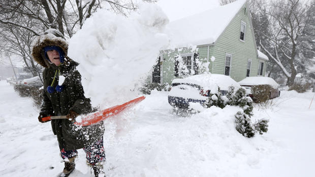 Peggy Udden, of Norwood, Mass., shovels her driveway in Norwood Feb. 5, 2014. 