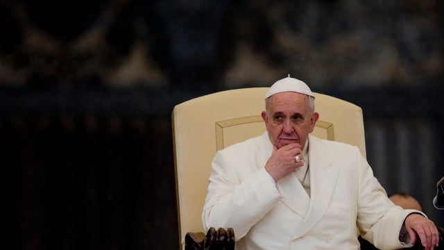 Pope Francis listens to his speech being translated in several languages, during his weekly general audience in St. Peter's Square at the Vatican 