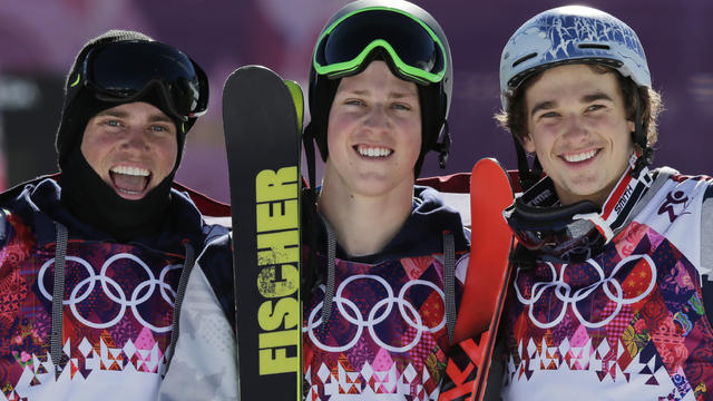 Men's ski slopestyle gold medal winner Joss Christensen of the United States, center, celebrates on the podium with his teammates Gus Kenworthy, left, silver, and Nicholas Goepper, bronze, right 