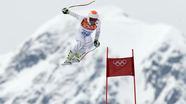 United States' Bode Miller makes a jump during Men's super combined downhill training at the Sochi 2014 Winter Olympics 