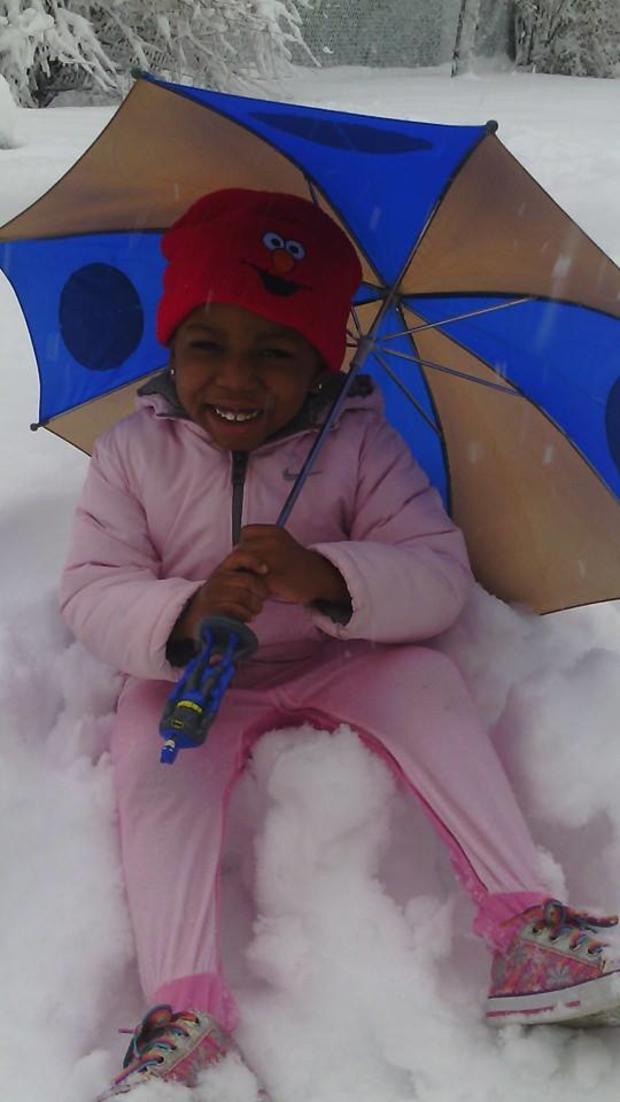 allison-jonas-my-daughter-aaliyah-with-her-umbrella-enjoying-the-snow-in-the-backyard.jpg 