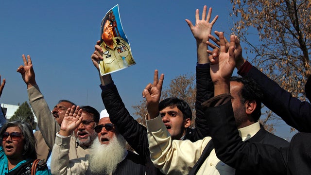 Supporters of former Pakistani President Pervez Musharraf chant slogans outside a court in Islamabad 