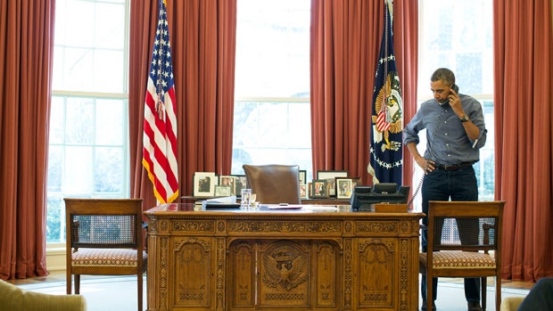President Obama talks on the phone in the Oval Office at the White House in Washington with Russian President Vladimir Putin about the situation in Ukraine March 1, 2014. 