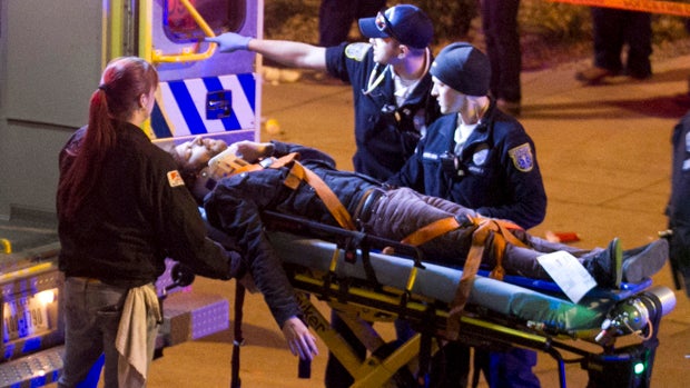 A man is moved into an ambulance after being struck by a vehicle in downtown Austin, Texas, during South By Southwest March 12, 2014. 