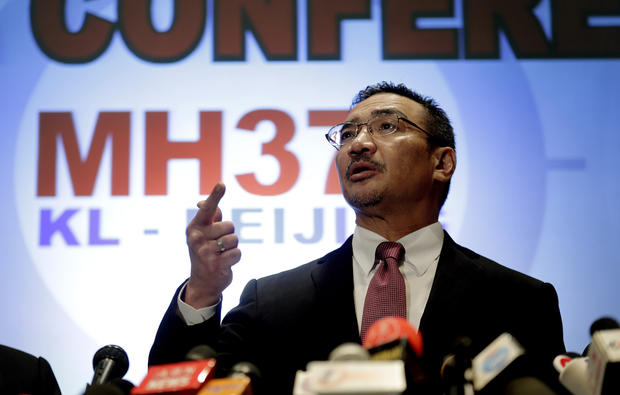 Malaysia's Minister of Transport Hishamuddin Hussein takes questions from the media during a press conference about the missing Malaysia Airlines jetliner MH370 