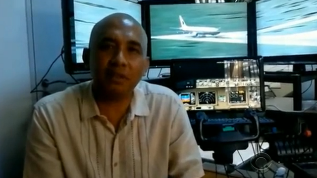 Malaysia Airlines pilot Zaharie Ahmad Shah with flight simulator 