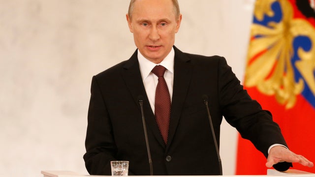 Russia's President Vladimir Putin addresses the Federation Council in Moscow's Kremlin 