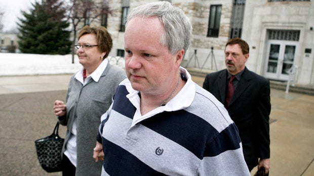 William Melchert-Dinkel, center, leaves the Rice County Courthouse with his attorney, Terry Watkins, and wife, Joyce Melchert-Dinkel, in Faribault, Minn., Feb. 17, 2011. 