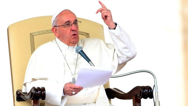 Pope Francis speaks during his weekly audience in St. Peter's Square March 19, 2014, in Vatican City. 