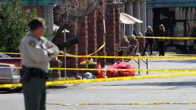 The FBI and the Pima County Sheriff's Department investigate the crime scene after Jared Loughner opened fire on a group of people Jan. 9, 2011, in Tucson, Ariz. 