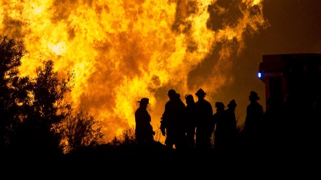 Firefighters work in the area of a reactivated wildfire in Valparaiso 