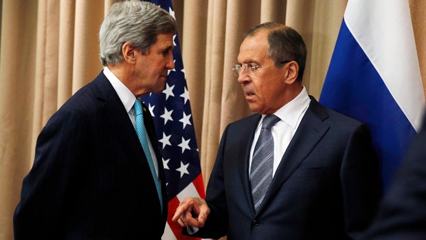 U.S. Secretary of State John Kerry, left, talks with Russian Foreign Minister Sergey Lavrov at the start of a bilateral meeting to discuss the ongoing situation in Ukraine as diplomats from the U.S., Ukraine, Russia and the European Union gather for discu 
