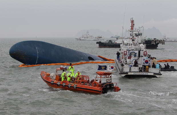 South Korean Coast Guard and rescue teams search for missing passengers at the site of the sunken ferry off the coast of Jindo Island 