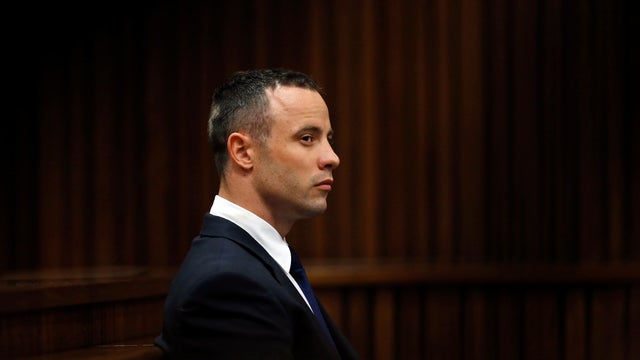 Oscar Pistorius sits in the dock in the North Gauteng High Court in Pretoria 