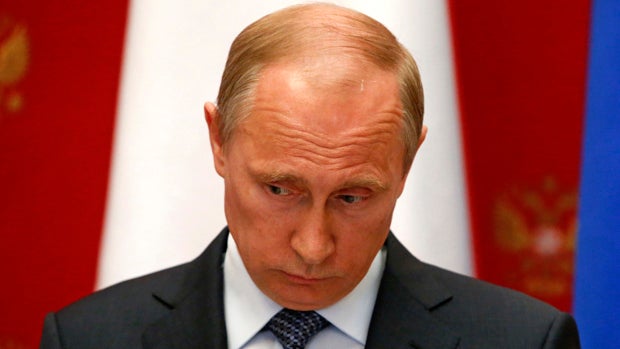 Russian President Vladimir Putin attends a news conference after a meeting with Swiss President and Foreign Minister Didier Burkhalter at the Kremlin in Moscow May 7, 2014. 