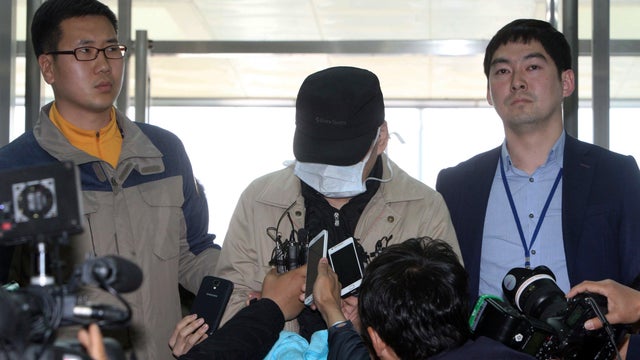 Kim Han-sik, center, president of Chonghaejin, speaks to media upon his arrival at a coastguard office in Mokpo, South Korea 